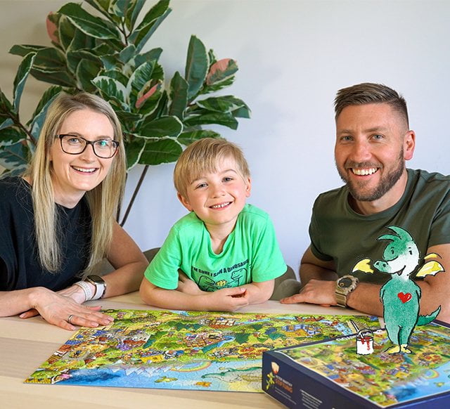 Familie puzzelt Tabaluga in der Märchenwelt Puzzle